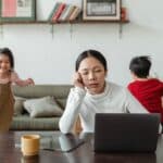 Kids making noise and disturbing mom working at home