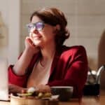 Woman in Red Blazer Wearing Blue Framed Sunglasses Sitting on Wheelchair