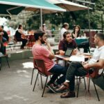 Three Men Sitting at the Table